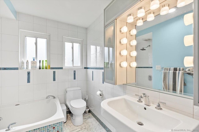 bathroom featuring sink, toilet, tile walls, tiled tub, and tasteful backsplash