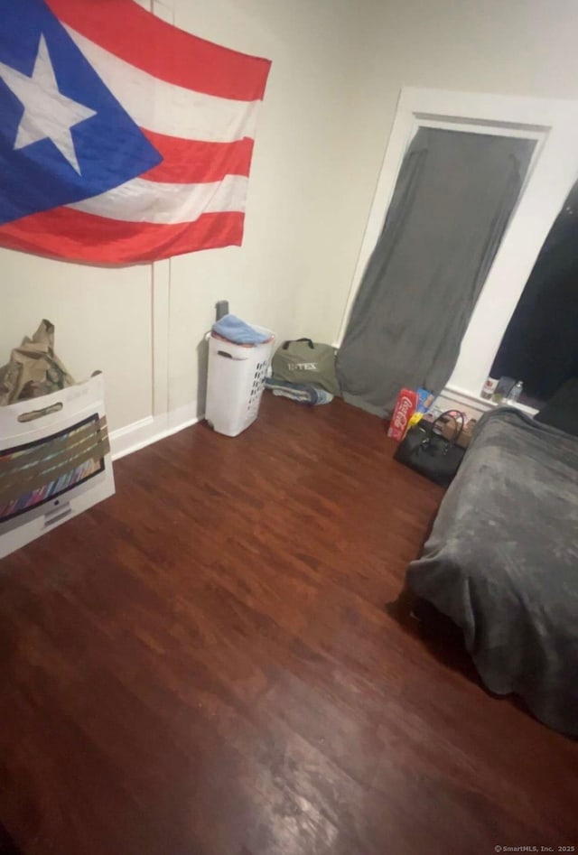 bedroom featuring dark hardwood / wood-style flooring