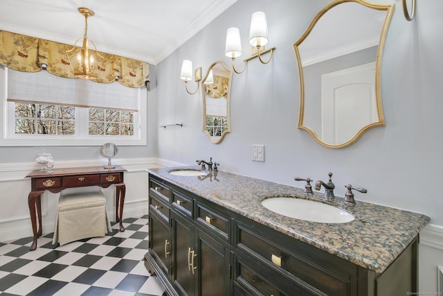 bathroom with crown molding and vanity