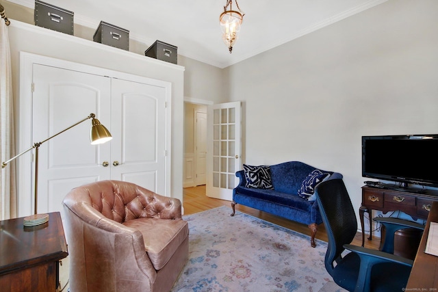 office space featuring crown molding and light hardwood / wood-style flooring