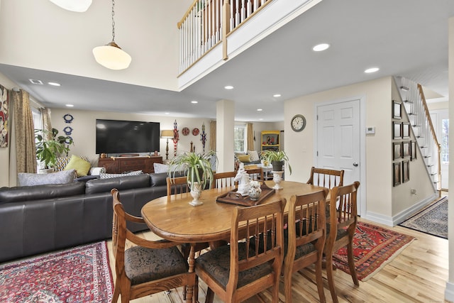 dining space featuring plenty of natural light and light wood-type flooring