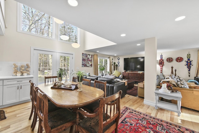 dining space with light hardwood / wood-style flooring