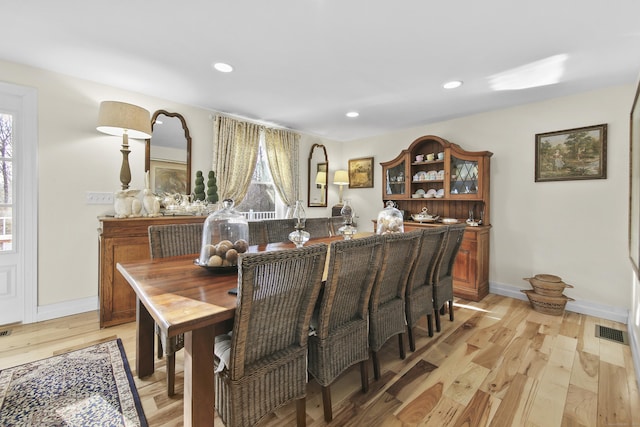 dining area with light hardwood / wood-style flooring