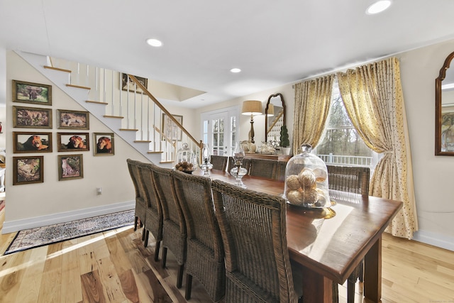 dining space featuring light wood-type flooring