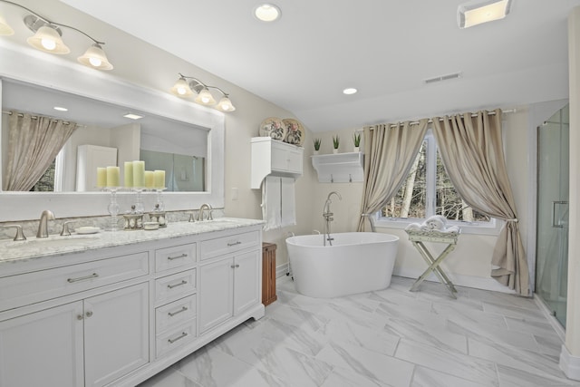 bathroom featuring separate shower and tub, vanity, and lofted ceiling