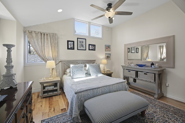 bedroom featuring hardwood / wood-style flooring, ceiling fan, and lofted ceiling