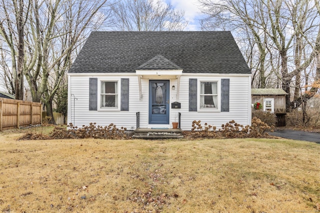 bungalow-style home featuring a front lawn