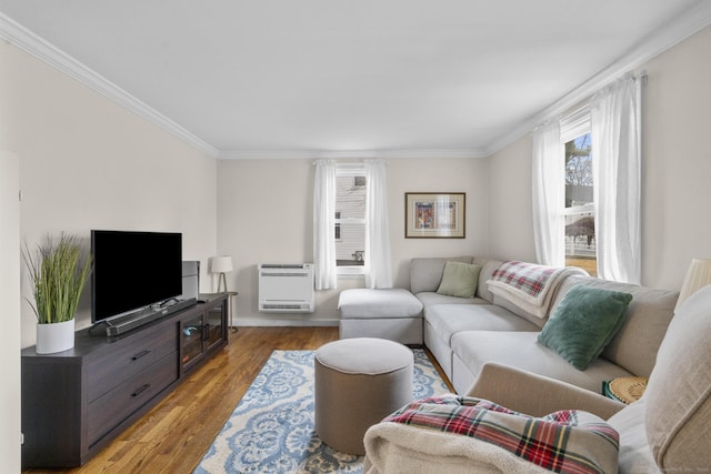 living room with heating unit, ornamental molding, and hardwood / wood-style flooring