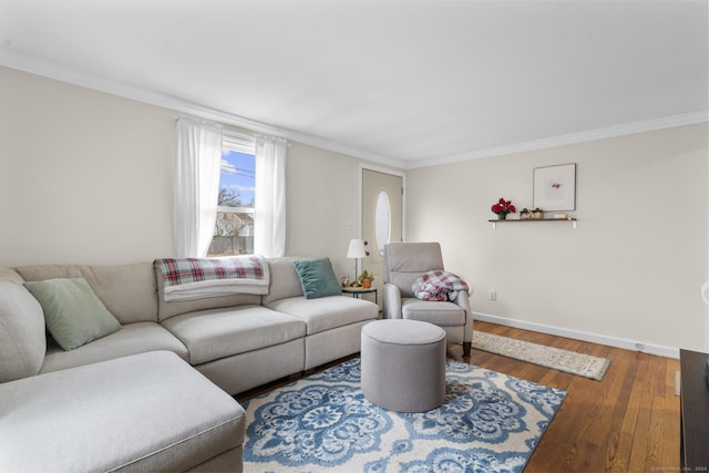 living room with hardwood / wood-style flooring and crown molding