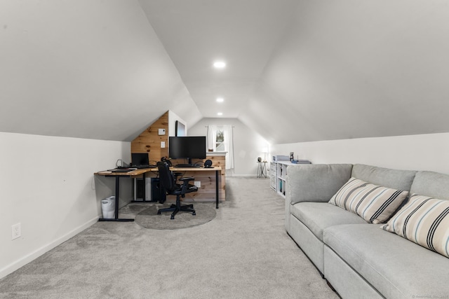 office space with light carpet and vaulted ceiling