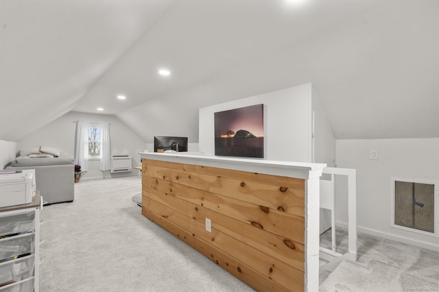 bonus room featuring light carpet and vaulted ceiling