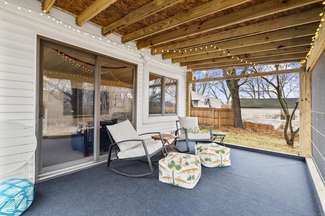 sunroom / solarium with beam ceiling and plenty of natural light