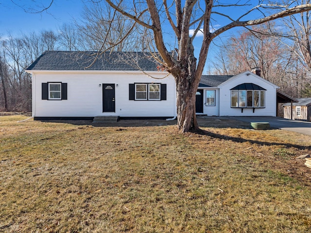 single story home with a carport and a front yard