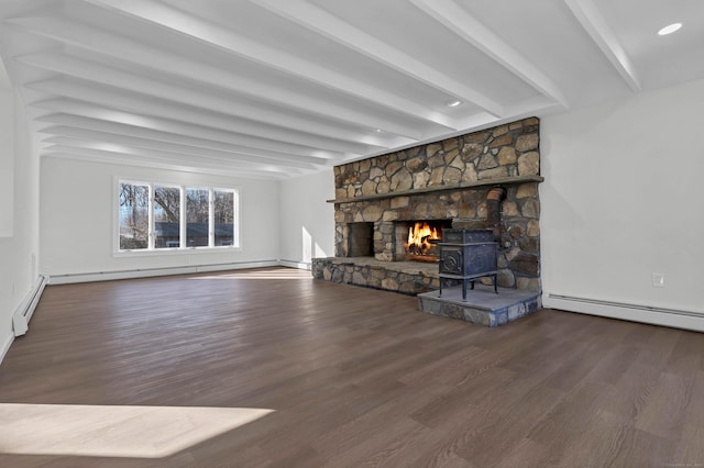 unfurnished living room featuring wood finished floors, beam ceiling, a baseboard heating unit, and baseboard heating
