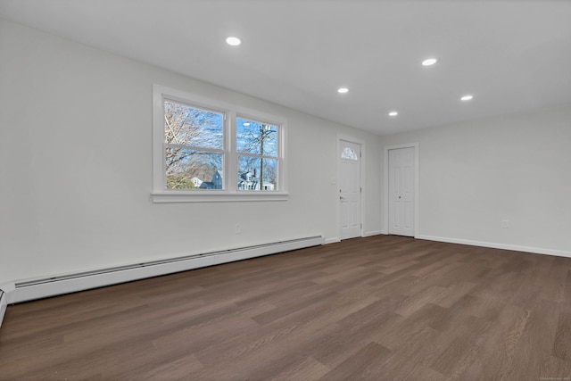 unfurnished room with dark wood-style flooring, recessed lighting, baseboards, and baseboard heating