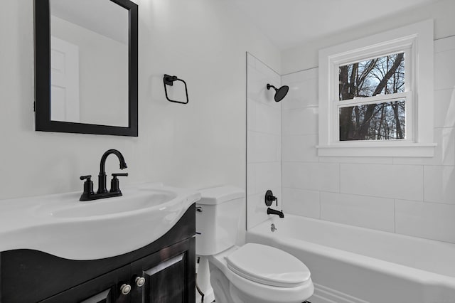 full bathroom featuring vanity, toilet, and tiled shower / bath