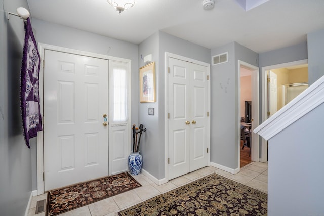 entryway featuring light tile patterned floors