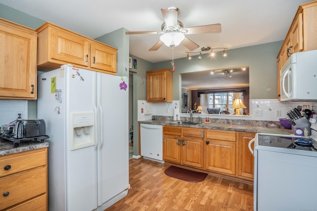 kitchen featuring decorative backsplash, sink, white appliances, and light hardwood / wood-style flooring