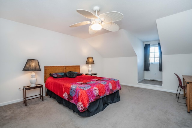 carpeted bedroom with ceiling fan and lofted ceiling