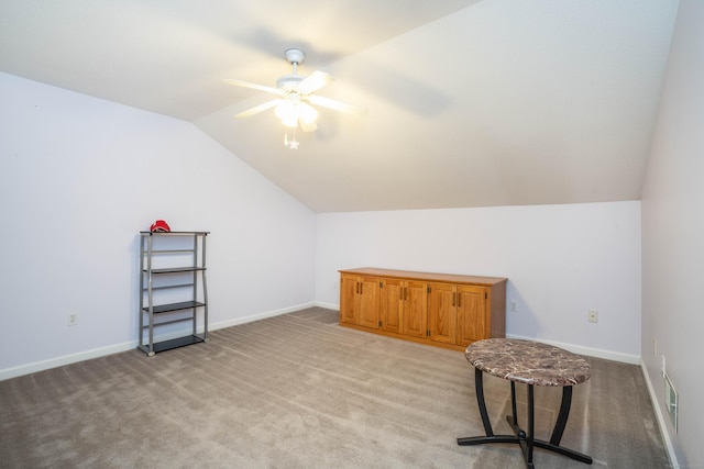 interior space featuring light colored carpet, ceiling fan, and lofted ceiling