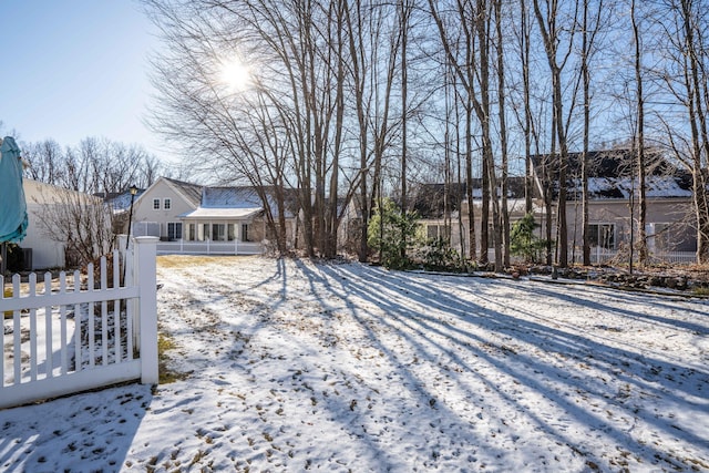 view of yard covered in snow