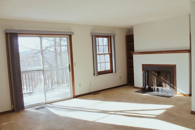 unfurnished living room with light carpet