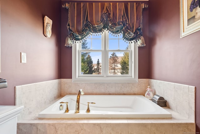 bathroom featuring tiled bath