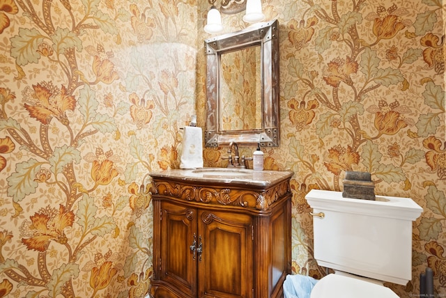 bathroom with vanity and toilet