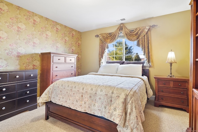 bedroom with light colored carpet