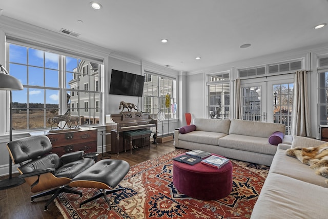 living room featuring dark wood-style floors, french doors, crown molding, recessed lighting, and visible vents