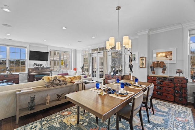 dining space featuring dark wood-style floors, recessed lighting, ornamental molding, and french doors