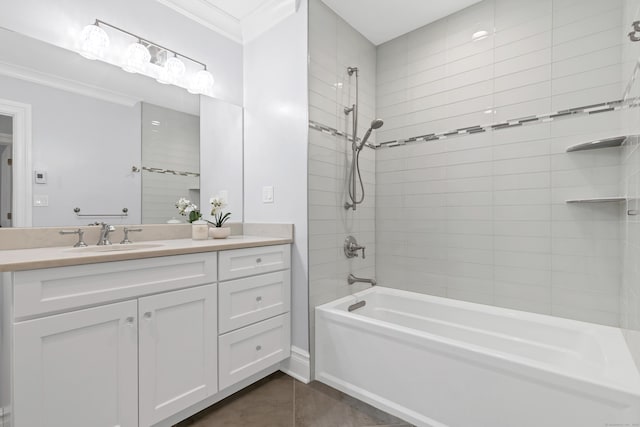 full bath featuring tile patterned floors, vanity, ornamental molding, and washtub / shower combination