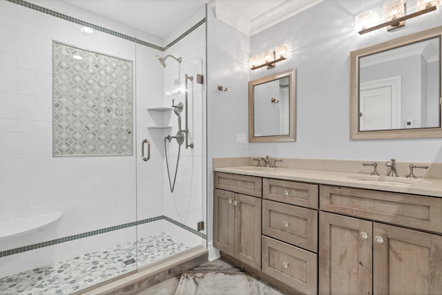 full bath featuring a shower stall, a sink, and ornamental molding