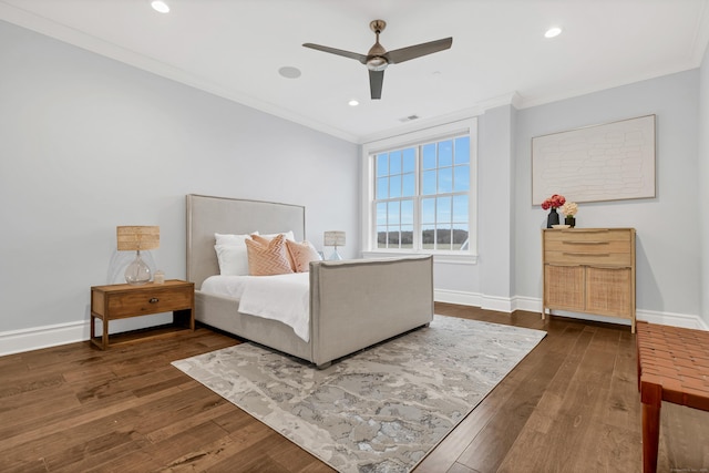 bedroom with wood-type flooring, ornamental molding, and baseboards