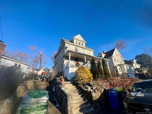 view of home's exterior featuring covered porch