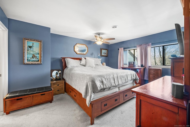 carpeted bedroom with ceiling fan