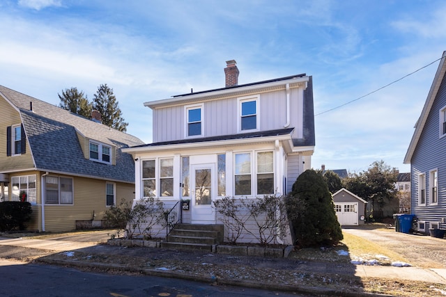 front facade featuring a sunroom