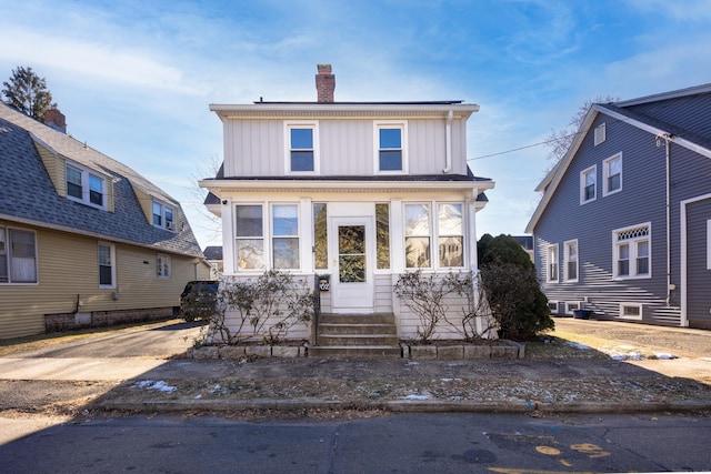 front facade with a sunroom