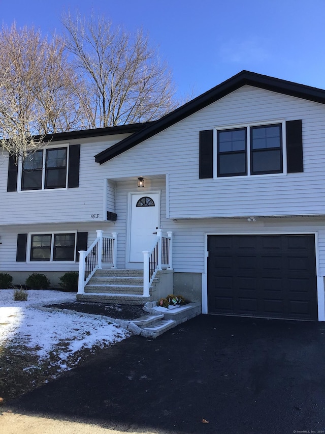 split foyer home featuring a garage