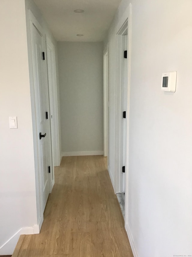 hallway featuring light hardwood / wood-style flooring