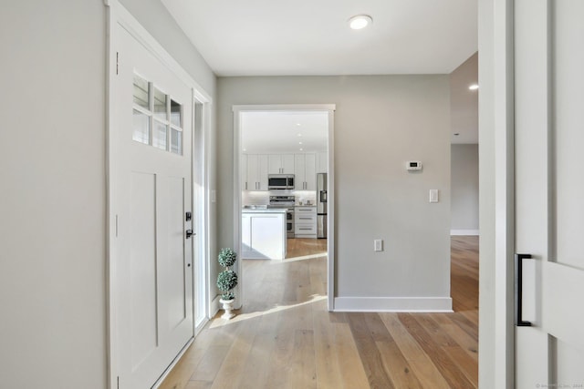 foyer with light hardwood / wood-style flooring