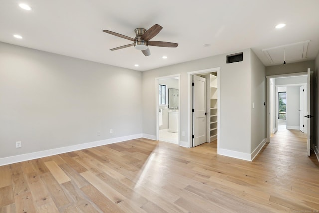 empty room featuring light wood-type flooring and ceiling fan