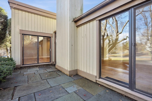 doorway to property with a patio area