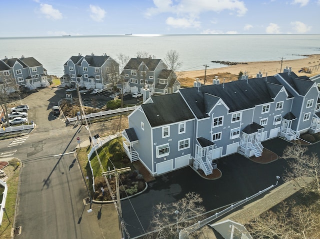 bird's eye view featuring a residential view and a water view