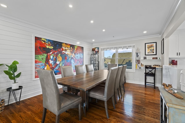 dining space with wood walls, dark hardwood / wood-style flooring, and ornamental molding