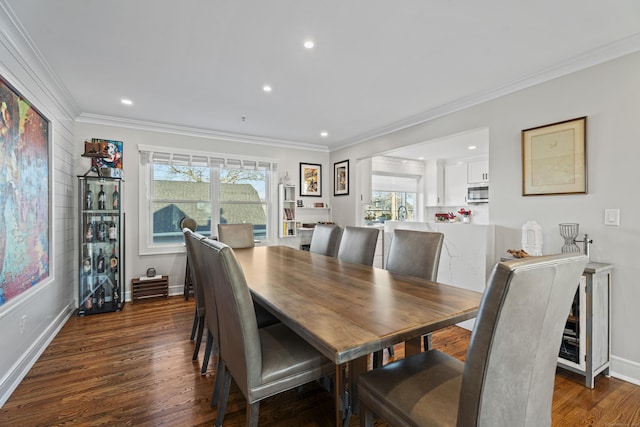 dining area with dark hardwood / wood-style flooring and ornamental molding