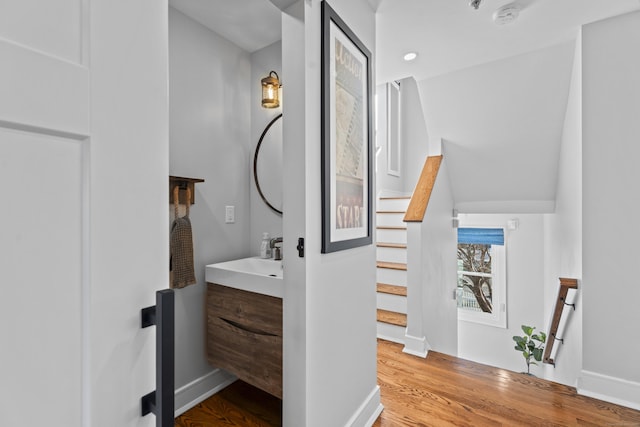 bathroom with hardwood / wood-style floors and vanity