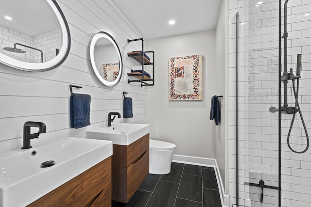 bathroom featuring a tile shower, vanity, and toilet