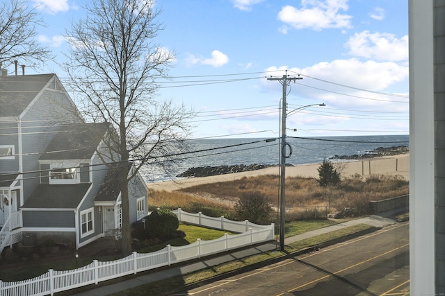 water view with a fenced front yard