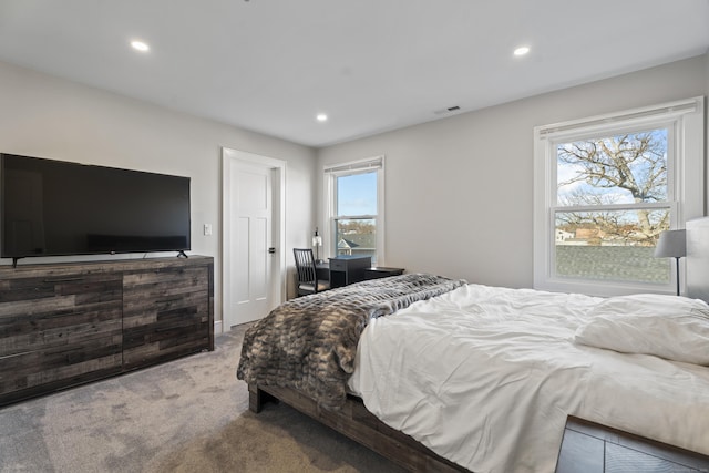 bedroom with carpet flooring, recessed lighting, and visible vents